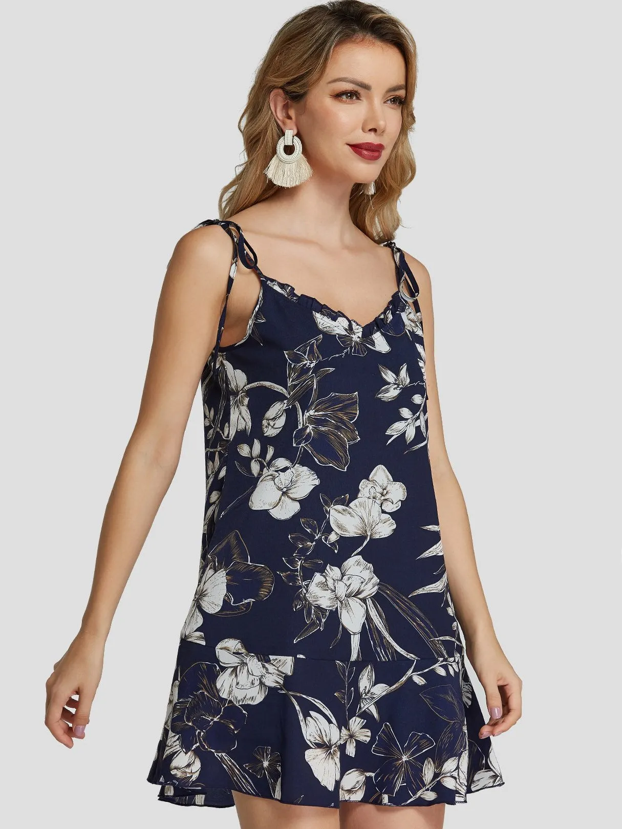 Wholesale Navy V-Neck Sleeveless Floral Print Backless Spaghetti Strap Self-Tie Ruffle Hem Dresses